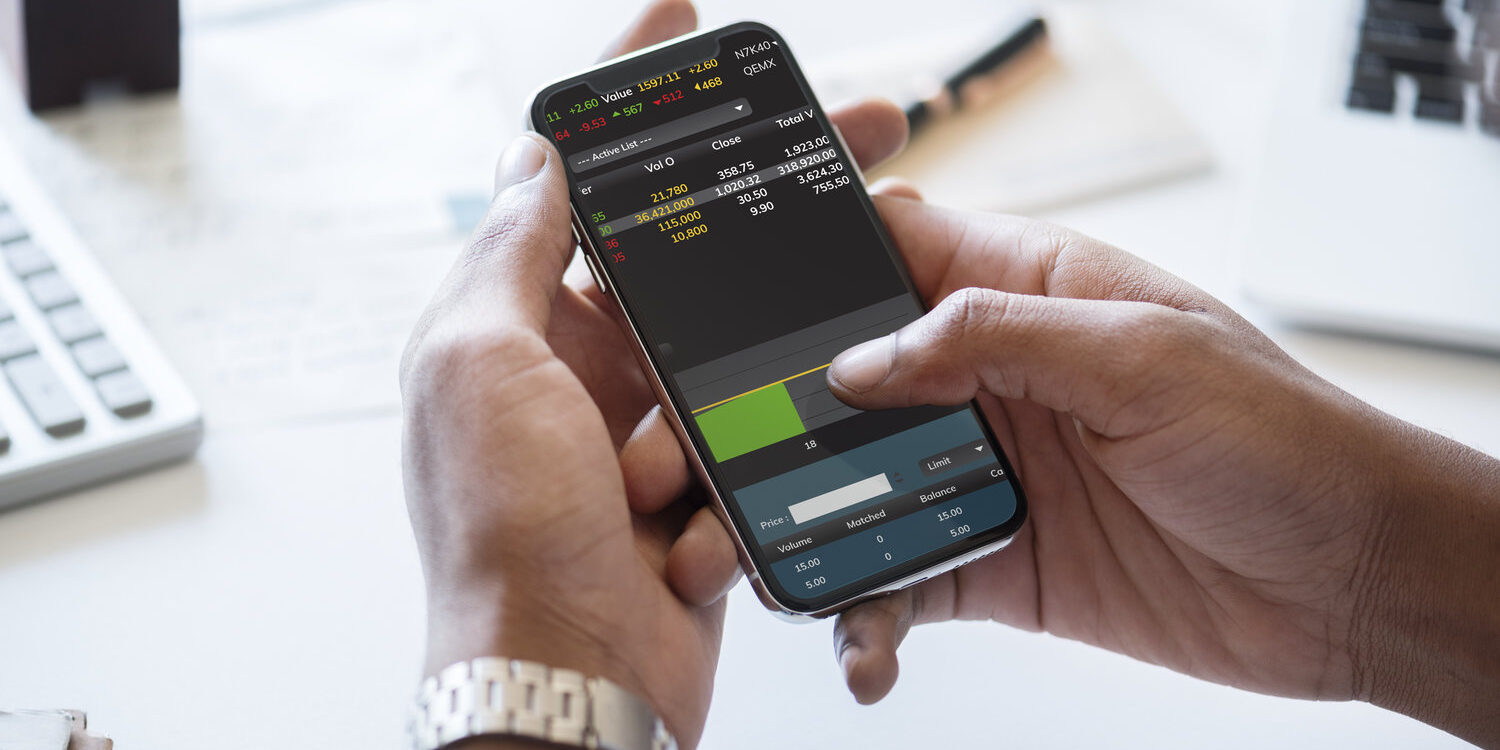 Businessman checking stock market online